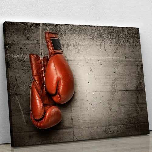 Boxing gloves hanging on concrete Canvas Print or Poster