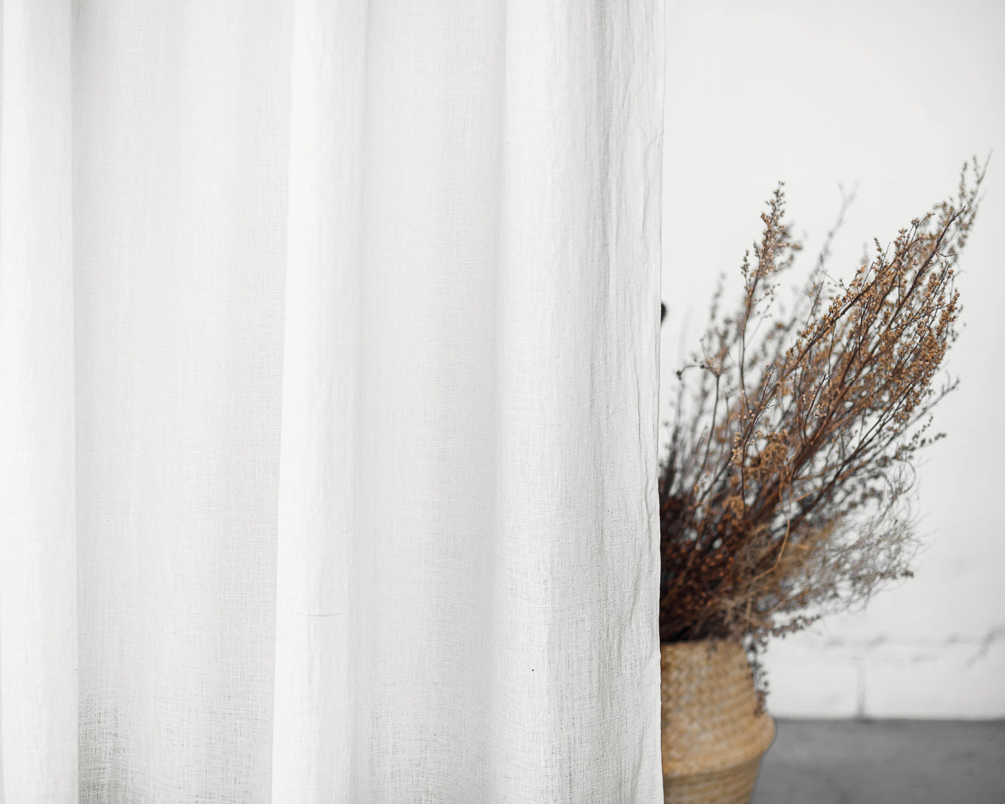 White linen curtain with tabs