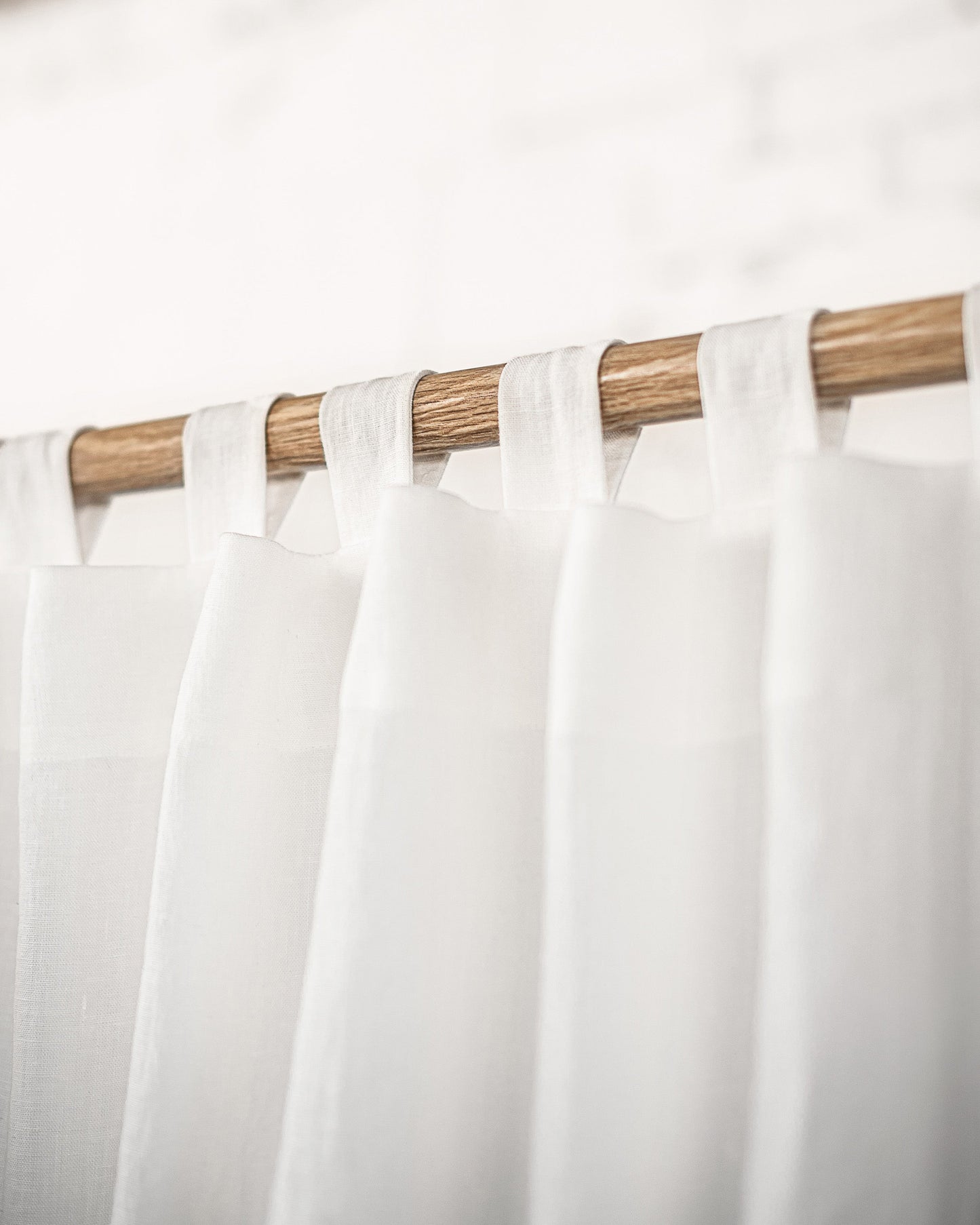 White linen curtain with tabs