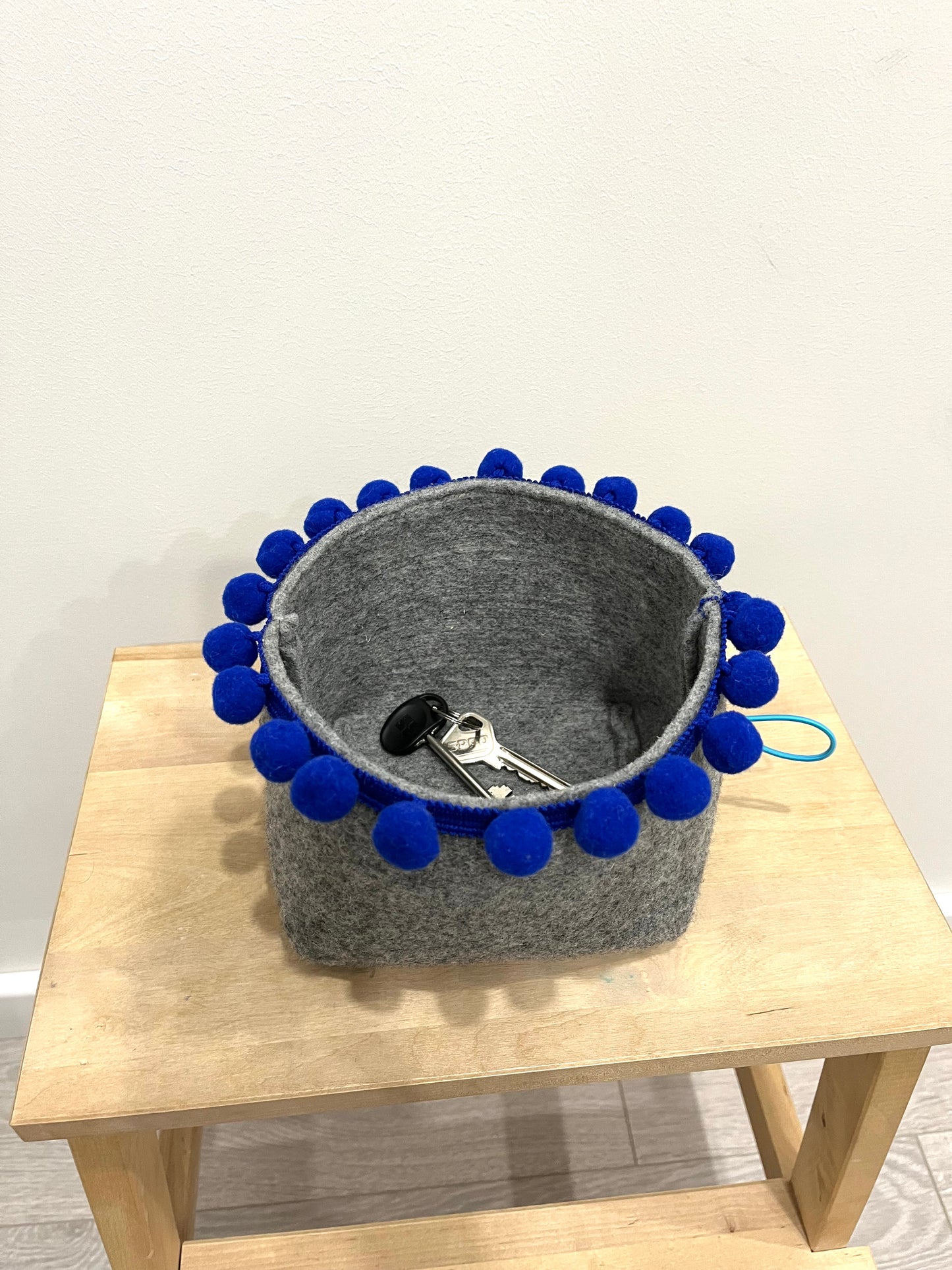 Saveplace® felty storage basket set with various colors pom poms