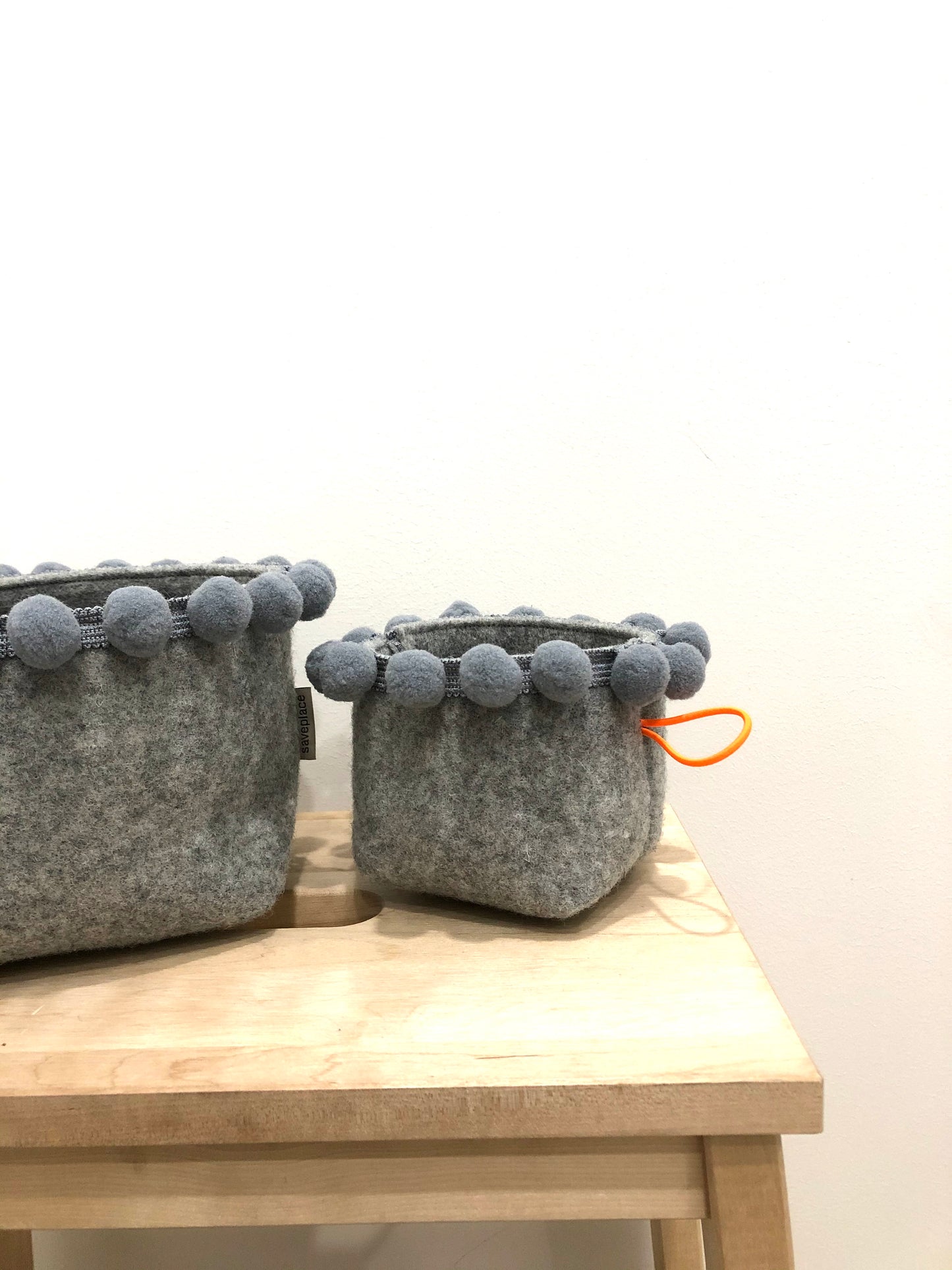 Saveplace® felty storage basket set with various colors pom poms